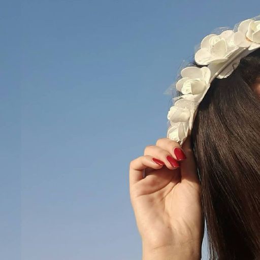 a woman with a flower crown on her head