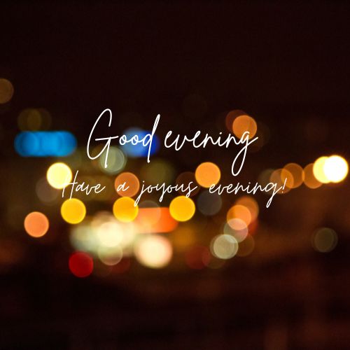  A blurred image of city lights at night with the text "Good evening" and "Have a joyous evening!" superimposed in white, cursive font.