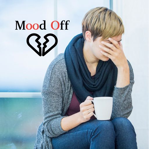  Woman looking upset while holding a coffee mug.