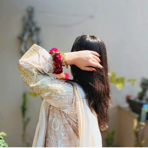 a woman with a flower in her hair