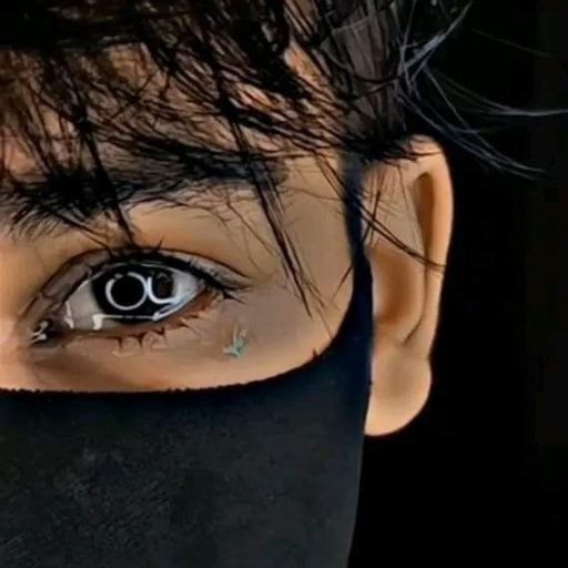 a close up of a person wearing a black mask