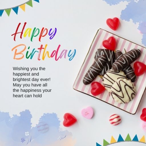 a birthday card with candies and hearts on a plate