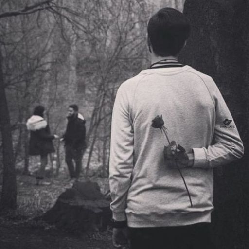 a black and white photo of a man running in the woods