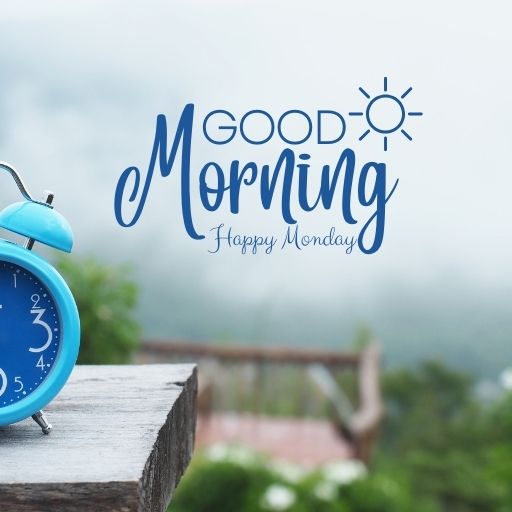 a blue alarm clock sitting on top of a wooden table