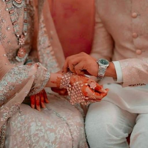 a bride and groom holding hands during a wedding ceremony