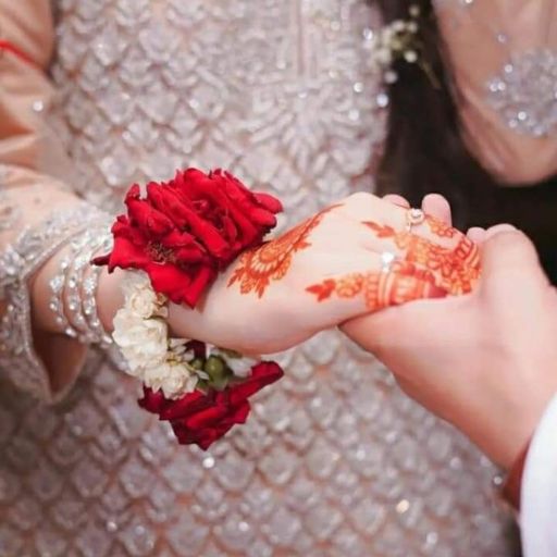 a close up of a person holding a bouquet of flowers