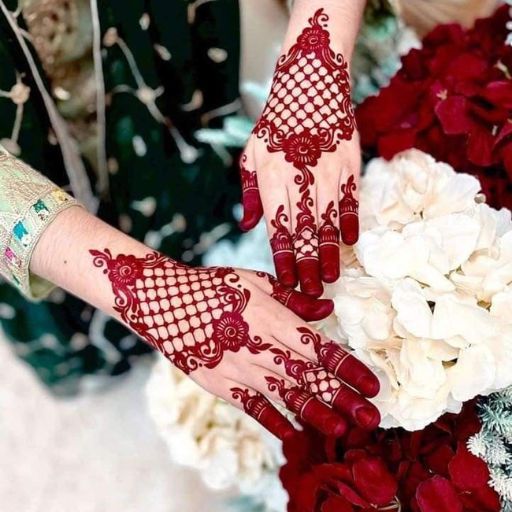 a close up of a person holding a bouquet of flowers