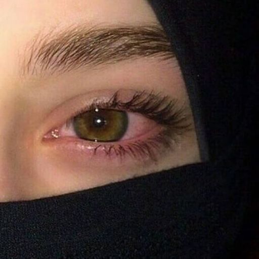 a close up of a person wearing a burka