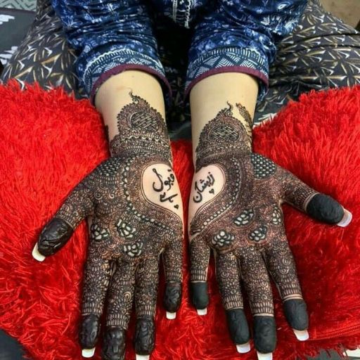 a close up of a person's hands on a rug