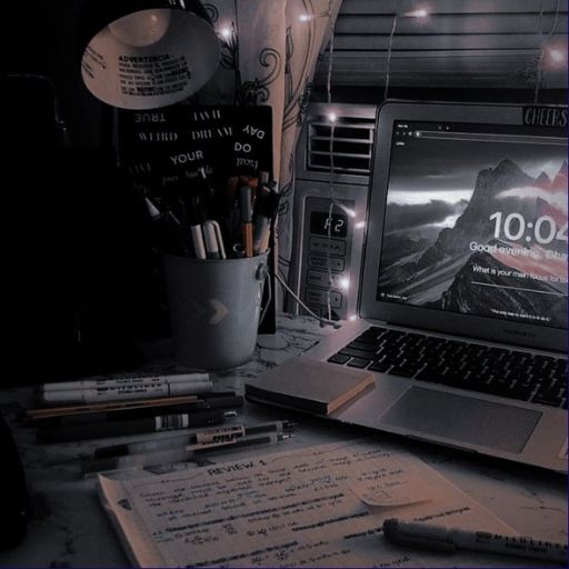 a laptop computer sitting on top of a desk