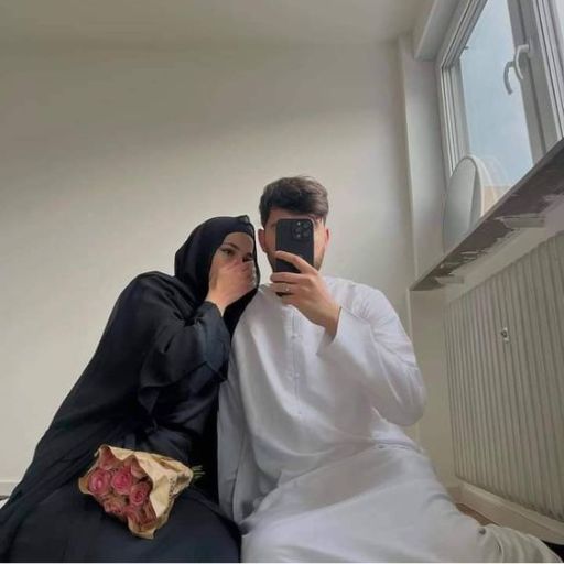 a man and a woman taking a selfie