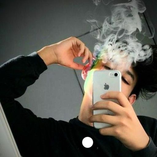 a man taking a picture of himself smoking a cigarette