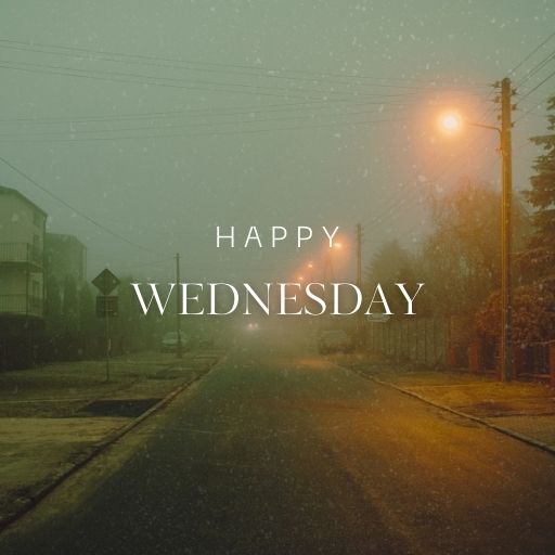 a picture of a street at night with the words happy wednesday