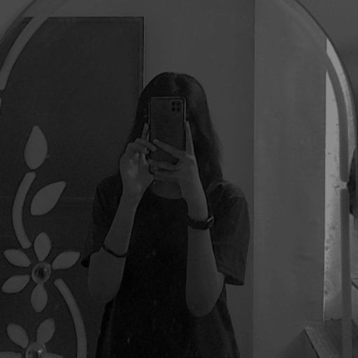 a woman taking a selfie in front of a mirror (2)