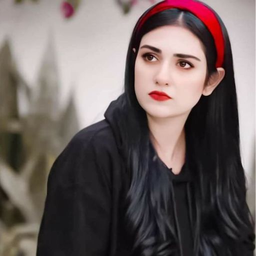 a woman with long black hair wearing a red headband