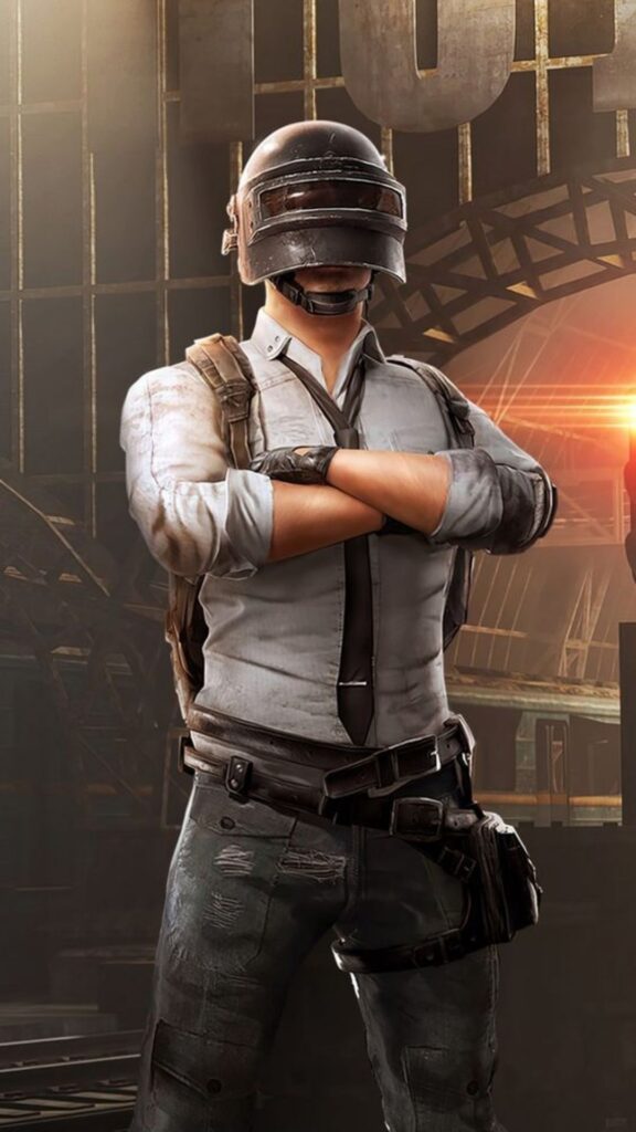 A character in a helmet and tactical gear with arms crossed in an industrial setting