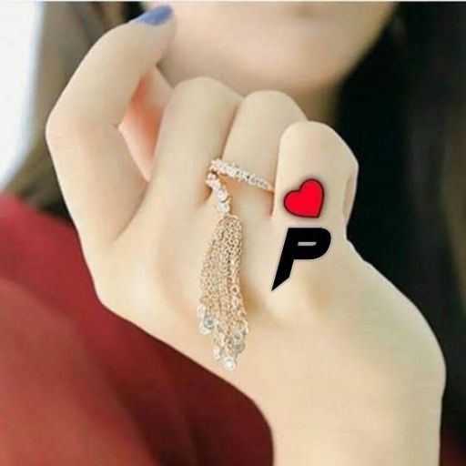 A hand with a blue nail holding an earring, with a heart and letter _P_ superimposed on the image