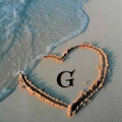 A heart drawn in the sand with a wave approaching it and a capital letter _G_ inside