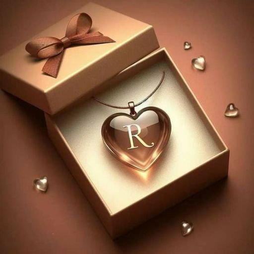 A heart-shaped pendant with the letter _R_ inside a gift box adorned with a bow, surrounded by tiny hearts