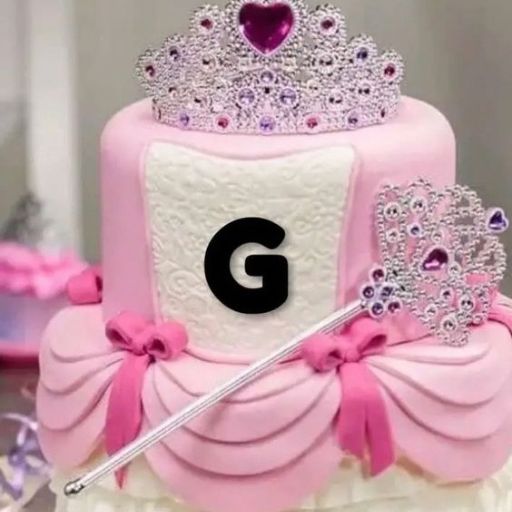 A pink and white tiered cake with a tiara, letter 'G', and a scepter decoration