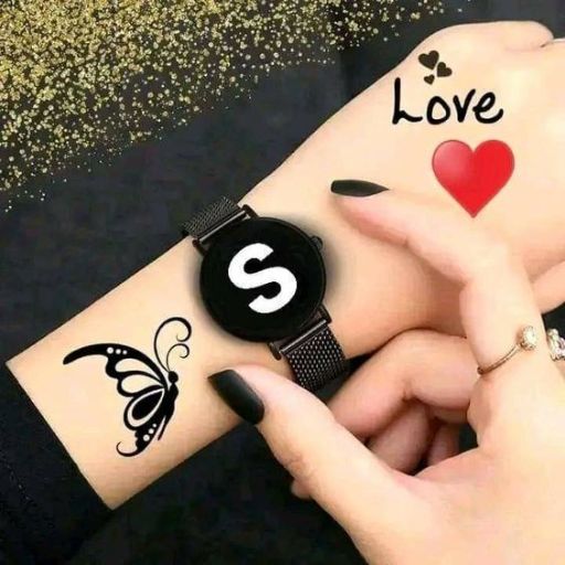 A wrist with a black watch and butterfly tattoo, with a hand displaying nail art and a 'love' tattoo