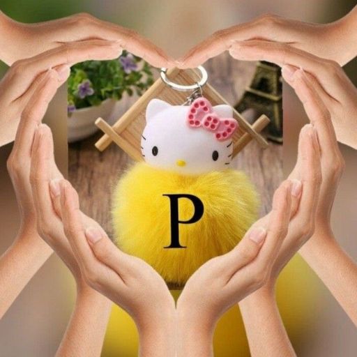 Four hands form heart shapes around a Hello Kitty keychain with a fluffy yellow pom-pom and initial _P