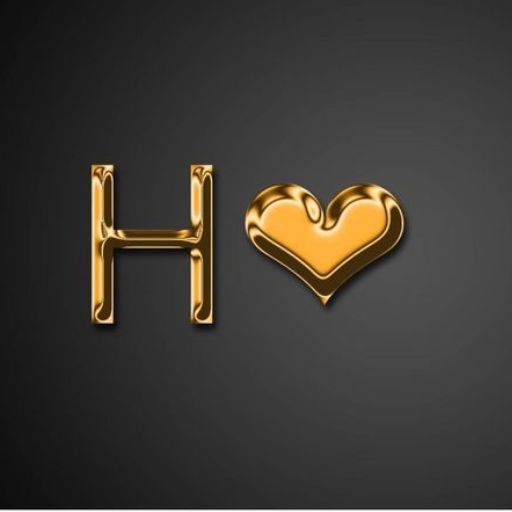 Golden letter 'H' and heart shape on a dark background