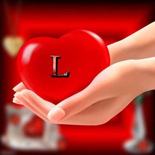 Hands holding a red heart with the letter 'L' on it, blurred red background