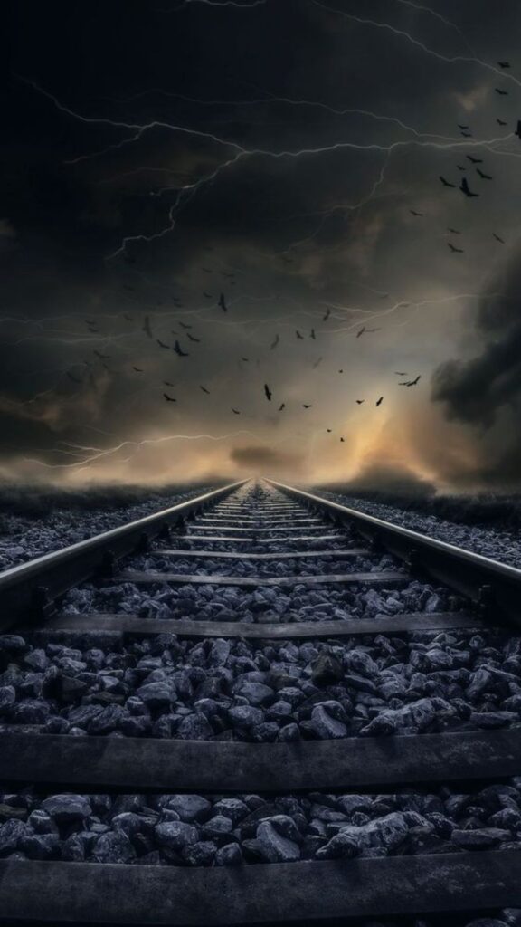 Railroad tracks leading into a stormy horizon with lightning and birds in the sky