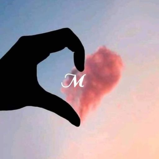 Silhouette of a hand forming a heart shape around a pink cloud with a letter 'M' in the center against a twilight sky