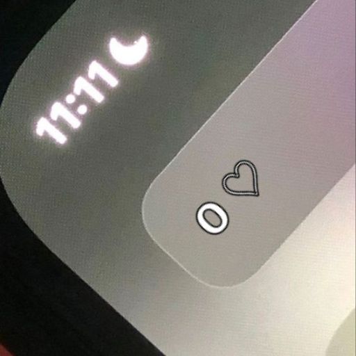 Smartwatch screen showing 11_11 with moon icon and heart rate symbol