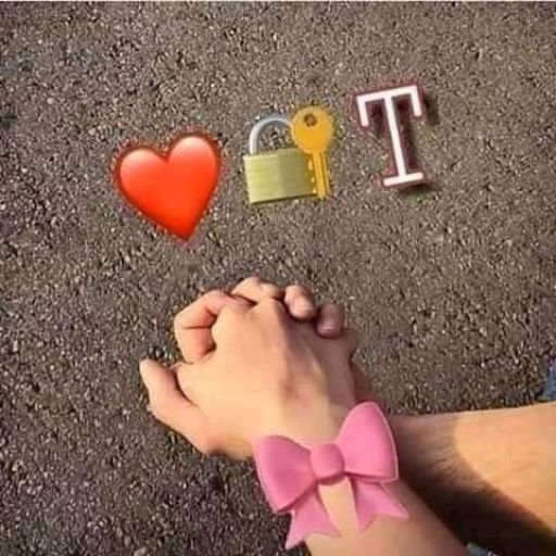 Two hands clasped together with a pink bow, a red heart, a lock and key, and the letter _T_ on a pavement