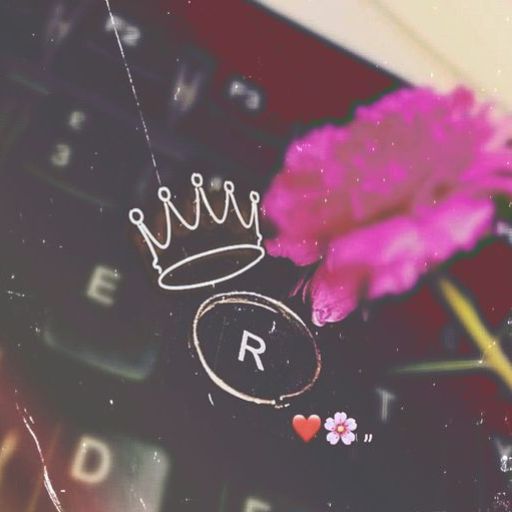 Vintage-style keyboard with a pink flower, a drawn crown above the 'R' key, and small heart and flower emojis