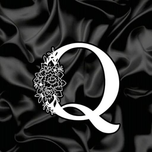 White floral letter Q on a black satiny background