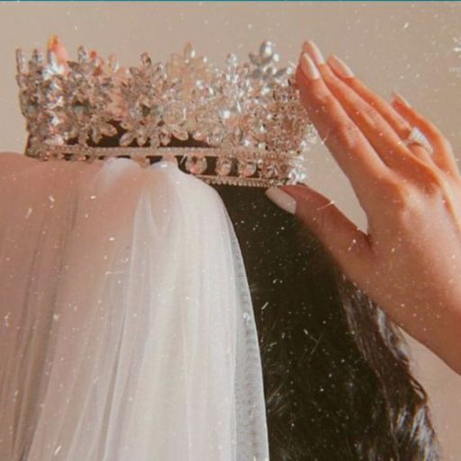 a close up of a person wearing a tiara