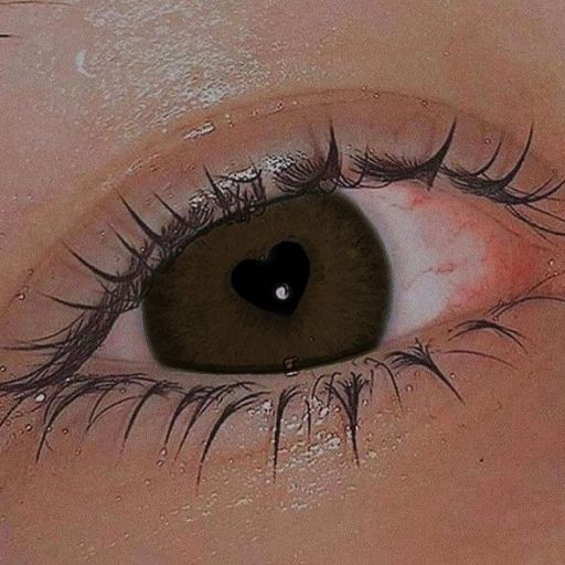 a close up of a person's eye with a heart on it