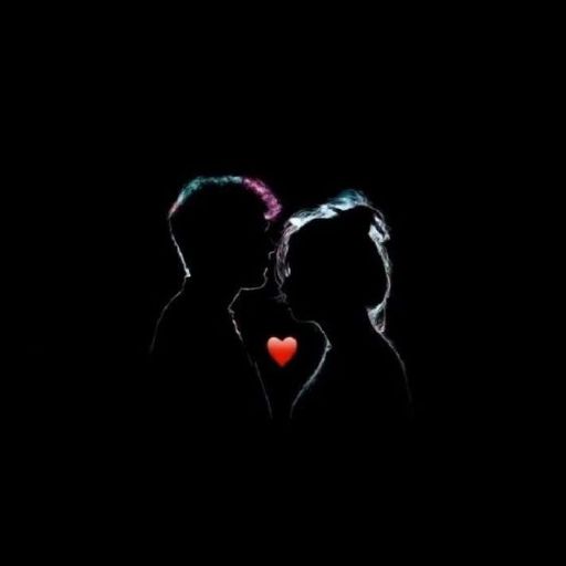 a couple kissing in the dark with a red heart