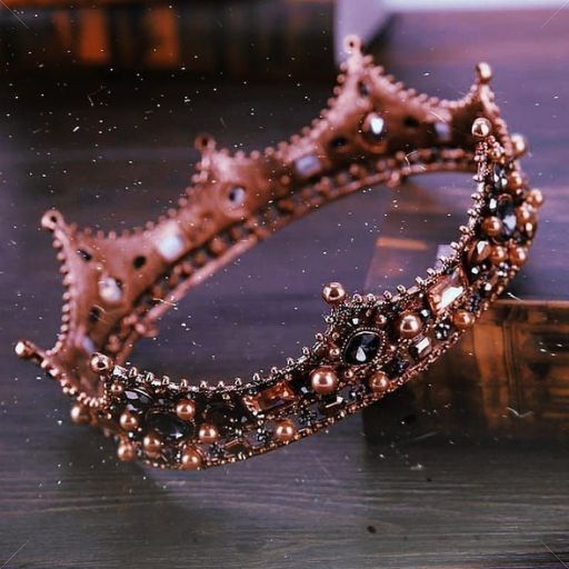 a crown sitting on top of a wooden table