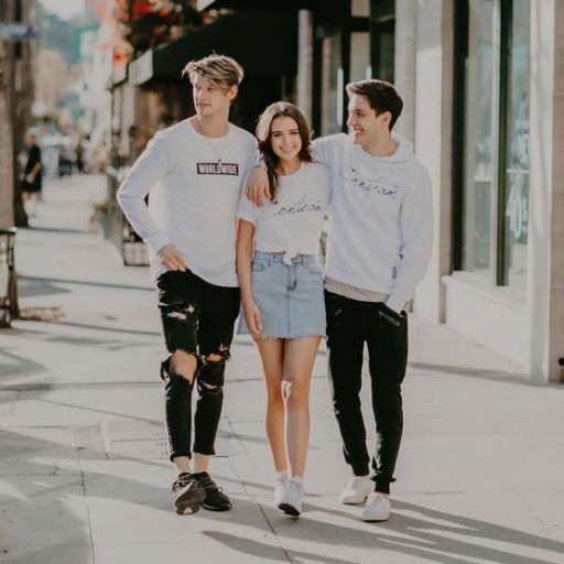 a group of young people walking down a street