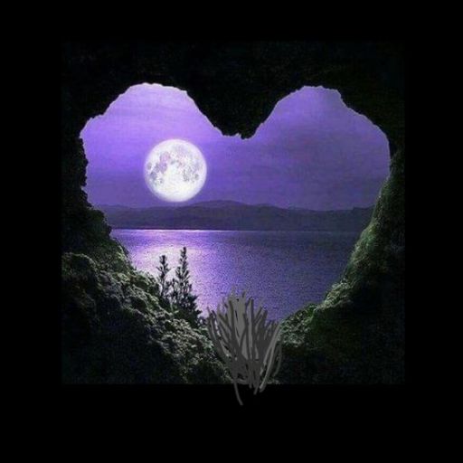 a heart shaped cave with a full moon in the background