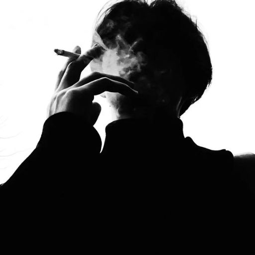 a person smoking a cigarette in a black and white photo