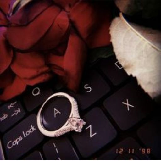 a ring sitting on top of a computer keyboard (2)