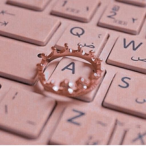 a ring sitting on top of a computer keyboard