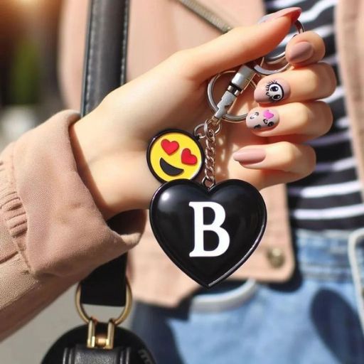 a woman holding a black heart shaped key chain