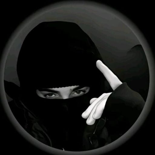 a woman in a black hoodie pointing at the camera