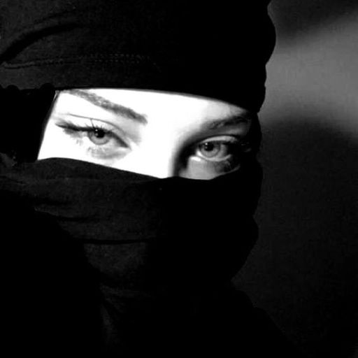 a woman wearing a black head covering over her face