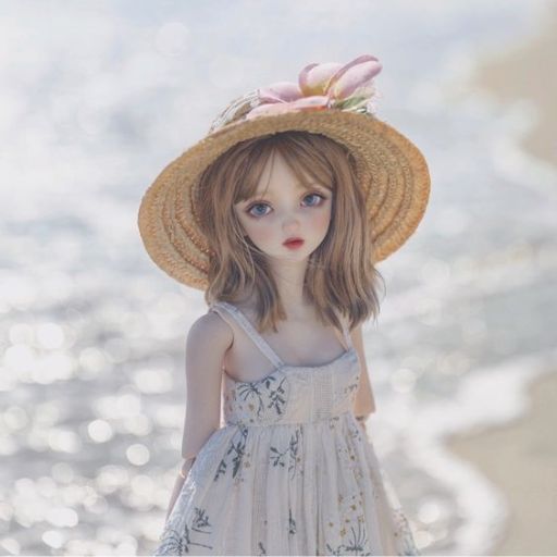 Child in a straw hat by the sea