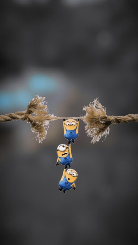 Three animated characters hanging in a chain from a frayed rope against a blurred background