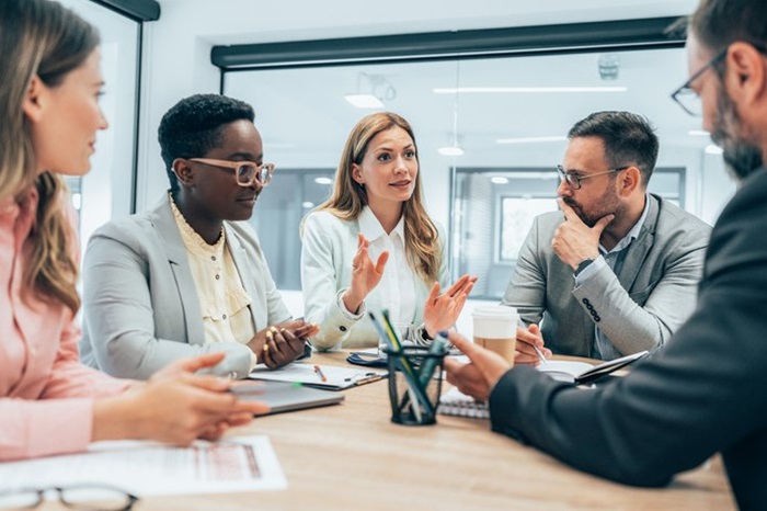 business meeting diverse team woman talking.max 1028x464 1